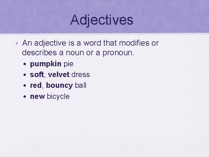 Adjectives • An adjective is a word that modifies or describes a noun or