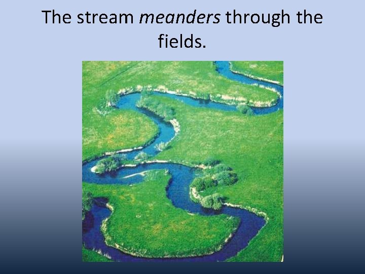 The stream meanders through the fields. 