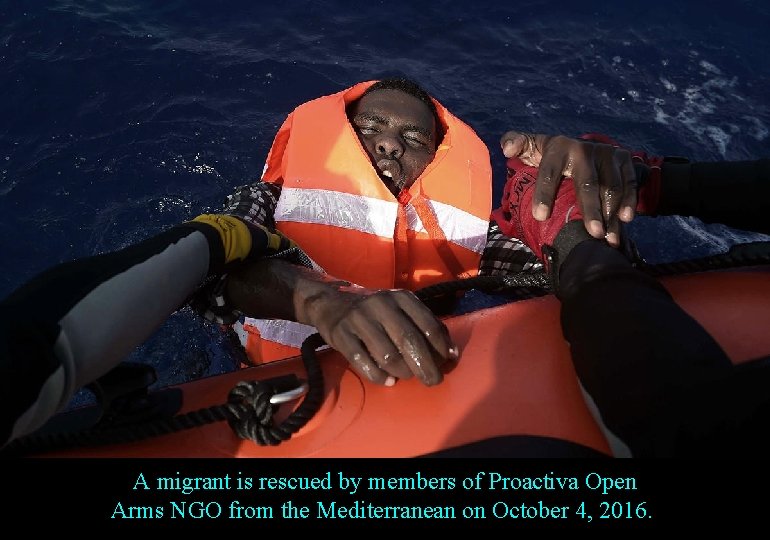 A migrant is rescued by members of Proactiva Open Arms NGO from the Mediterranean