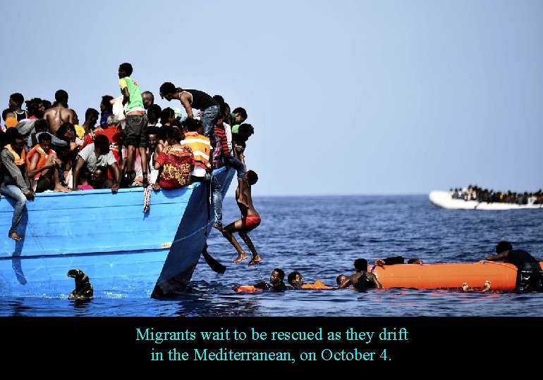 Migrants wait to be rescued as they drift in the Mediterranean, on October 4.