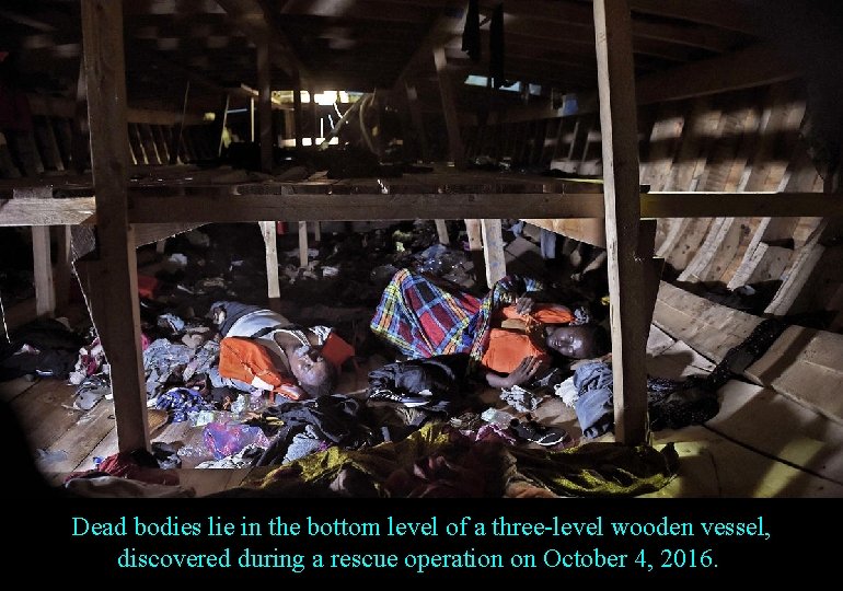 Dead bodies lie in the bottom level of a three-level wooden vessel, discovered during