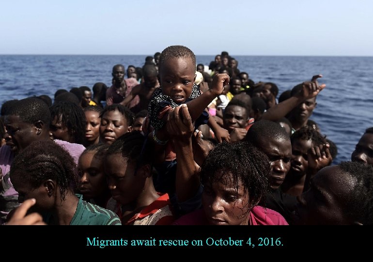 Migrants await rescue on October 4, 2016. 