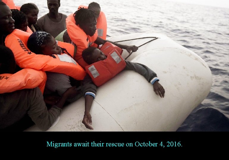 Migrants await their rescue on October 4, 2016. 