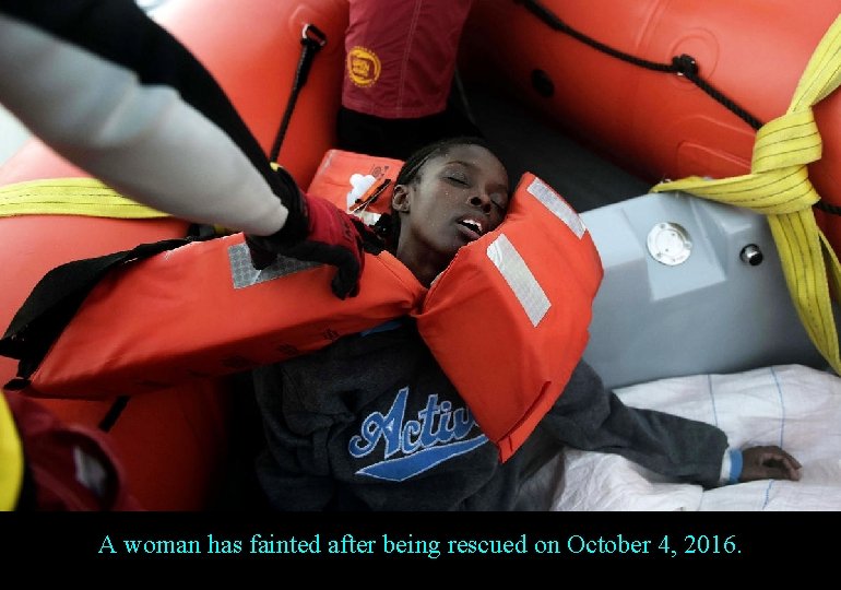 A woman has fainted after being rescued on October 4, 2016. 