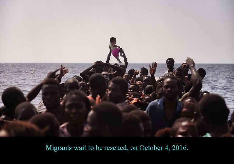 Migrants wait to be rescued, on October 4, 2016. 