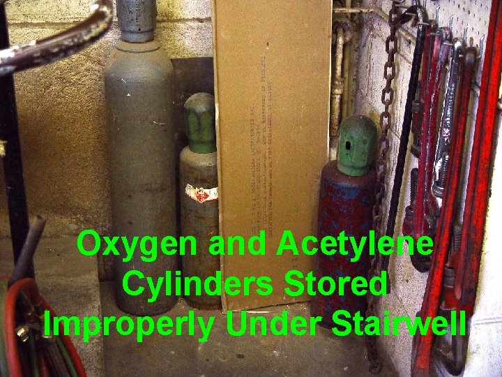 Oxygen and Acetylene Cylinders Stored Improperly Under Stairwell 