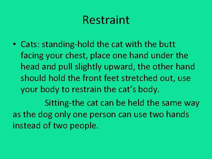 Restraint • Cats: standing-hold the cat with the butt facing your chest, place one