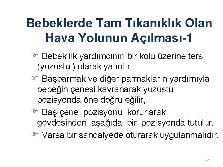 Bebeklerde Tam Tıkanıklık Olan Hava Yolunun Açılması-1 Bebek ilk yardımcının bir kolu üzerine ters