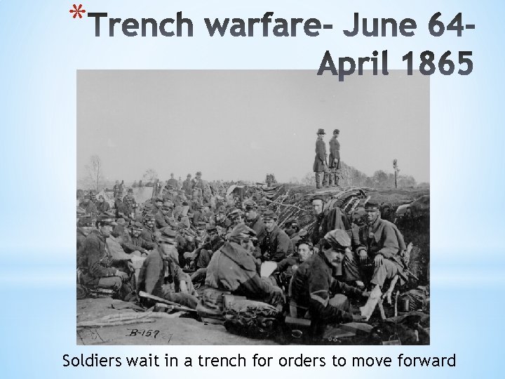 * Soldiers wait in a trench for orders to move forward 