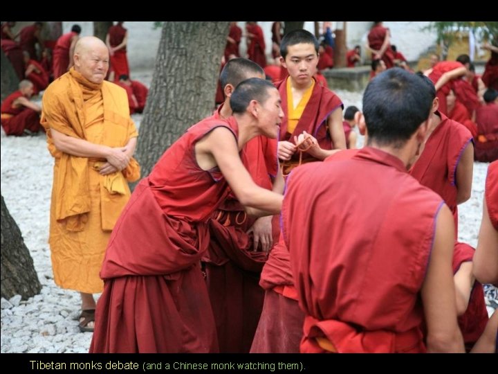 Tibetan monks debate (and a Chinese monk watching them). Tibetan monks debate (and a Chinese monk watching them).