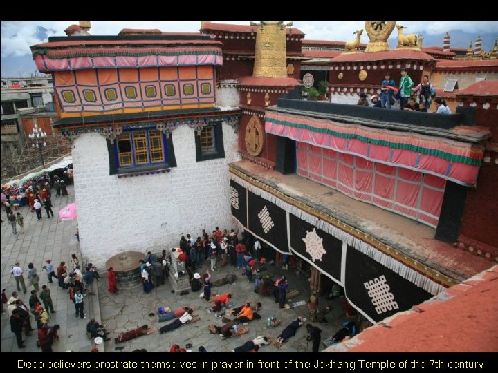 Deep believers prostrate themselves in prayer in front of the Jokhang Temple of the Deep believers prostrate themselves in prayer in front of the Jokhang Temple of the