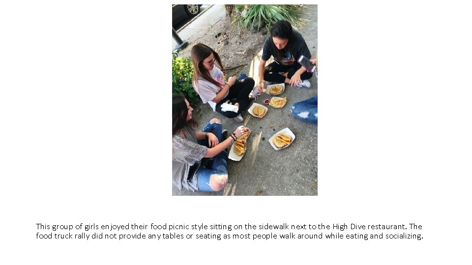 This group of girls enjoyed their food picnic style sitting on the sidewalk next