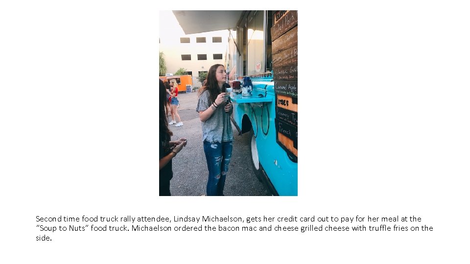Second time food truck rally attendee, Lindsay Michaelson, gets her credit card out to