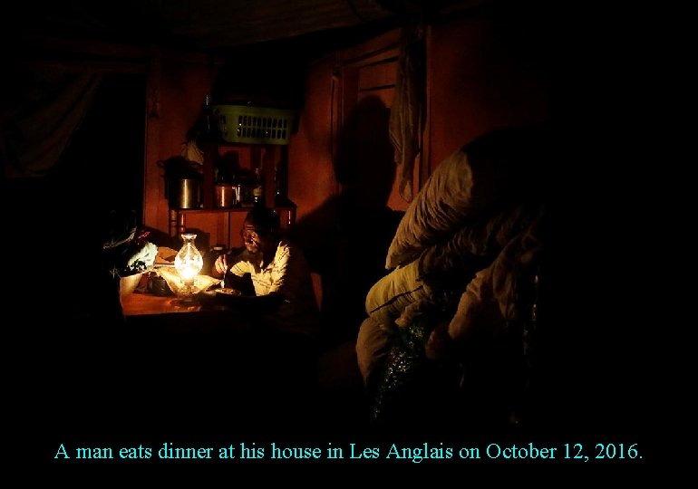 A man eats dinner at his house in Les Anglais on October 12, 2016.