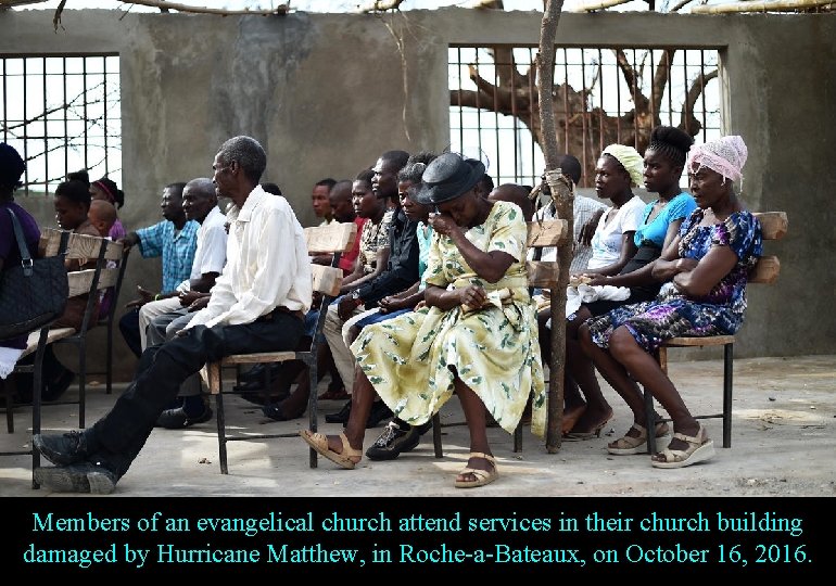 Members of an evangelical church attend services in their church building damaged by Hurricane