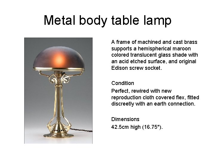 Metal body table lamp A frame of machined and cast brass supports a hemispherical