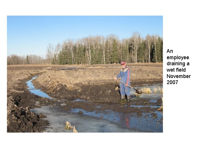 An employee draining a wet field November 2007 