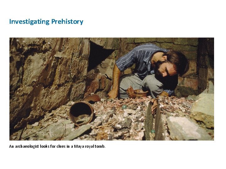 Investigating Prehistory An archaeologist looks for clues in a Maya royal tomb. 