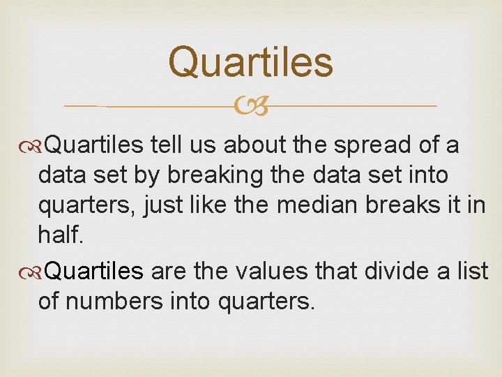 Quartiles tell us about the spread of a data set by breaking the data