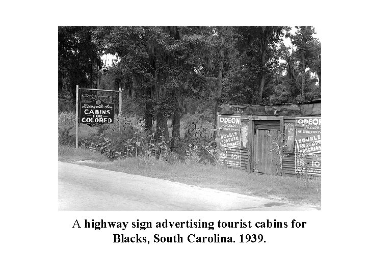 A highway sign advertising tourist cabins for Blacks, South Carolina. 1939. 