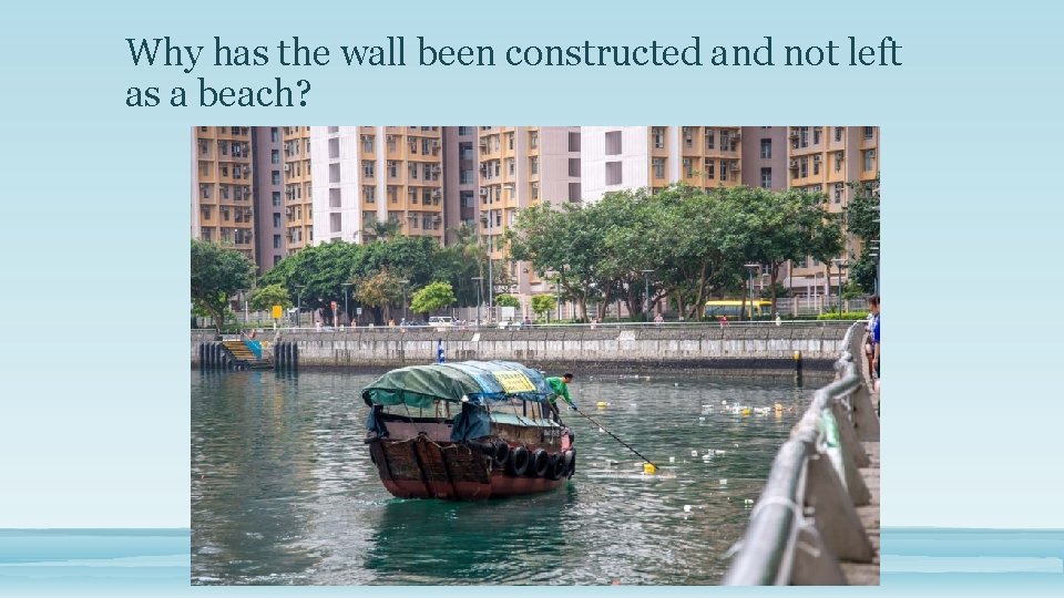 Why has the wall been constructed and not left as a beach? 