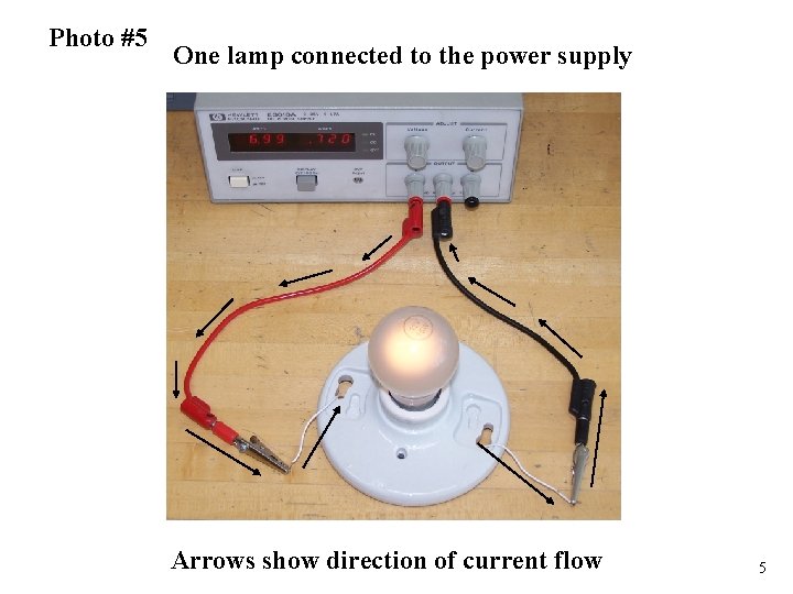 Photo #5 One lamp connected to the power supply Arrows show direction of current