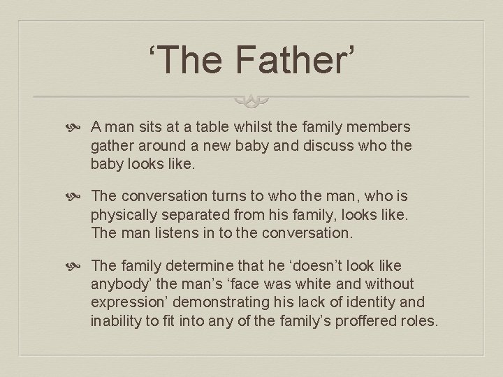 ‘The Father’ A man sits at a table whilst the family members gather around