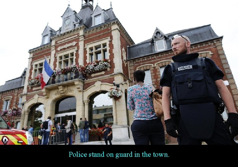 Police stand on guard in the town. 