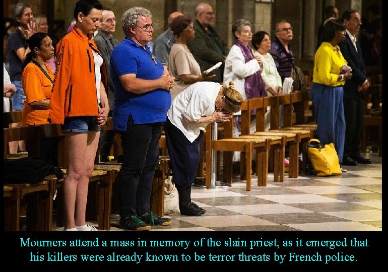 Mourners attend a mass in memory of the slain priest, as it emerged that