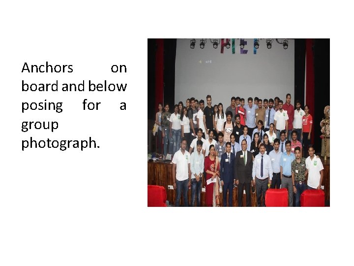 Anchors on board and below posing for a group photograph. 