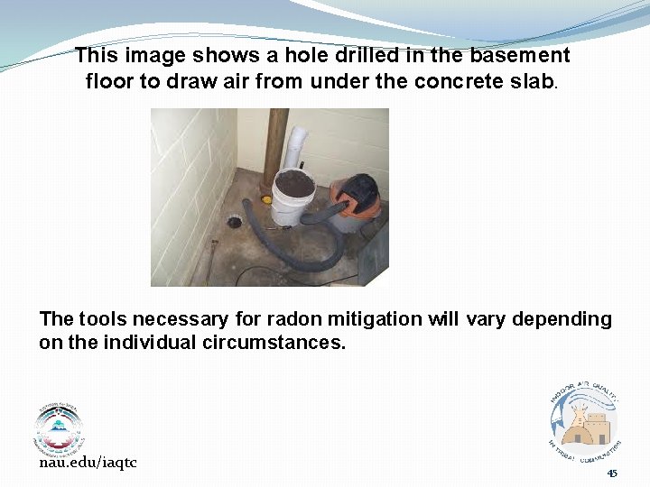 This image shows a hole drilled in the basement floor to draw air from