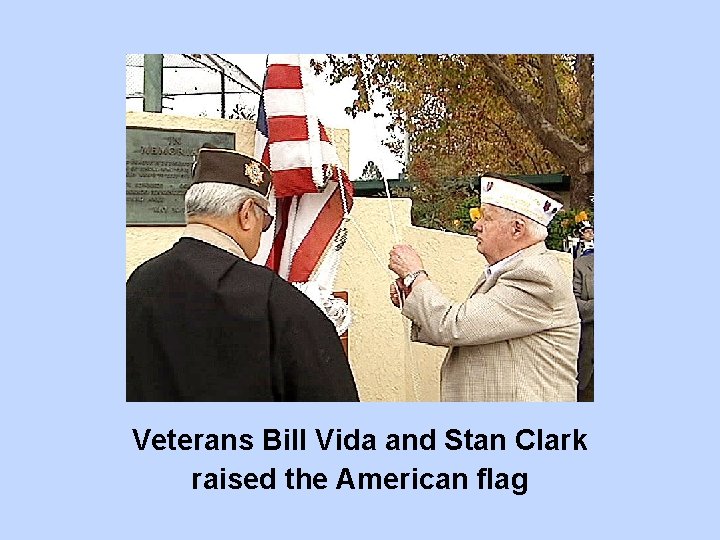 Veterans Bill Vida and Stan Clark raised the American flag 