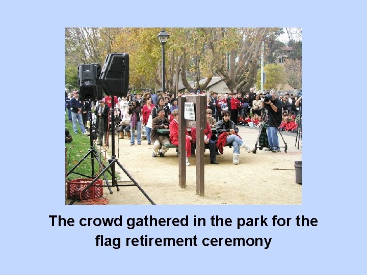 The crowd gathered in the park for the flag retirement ceremony 