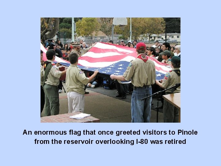 An enormous flag that once greeted visitors to Pinole from the reservoir overlooking I-80
