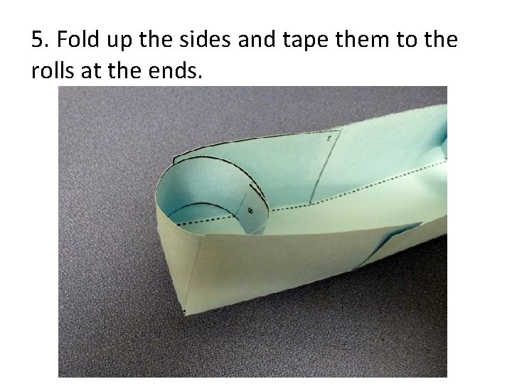 5. Fold up the sides and tape them to the rolls at the ends.