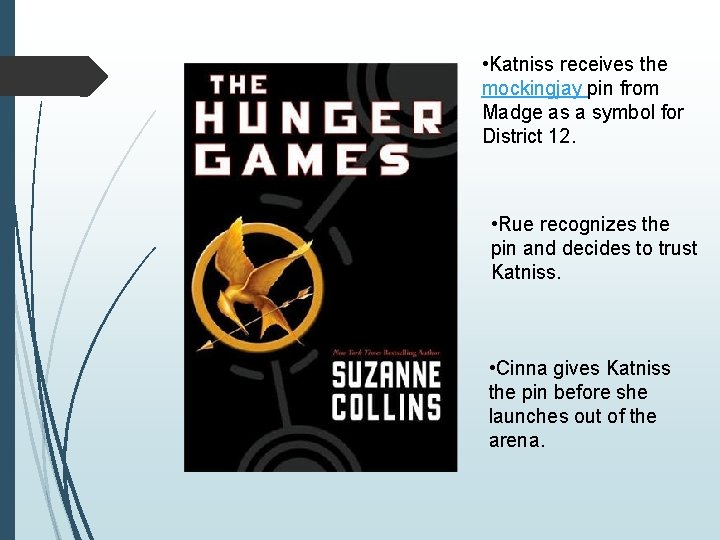  • Katniss receives the mockingjay pin from Madge as a symbol for District