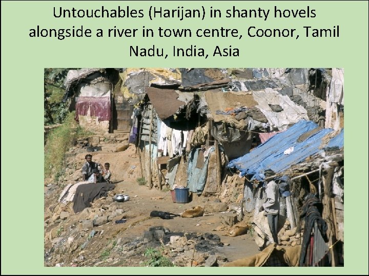 Untouchables (Harijan) in shanty hovels alongside a river in town centre, Coonor, Tamil Nadu,