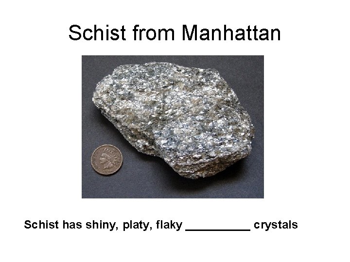 Schist from Manhattan Schist has shiny, platy, flaky _____ crystals 