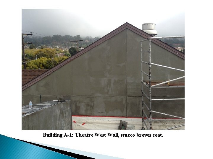 Building A-1: Theatre West Wall, stucco brown coat. 