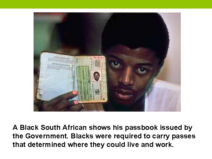 A Black South African shows his passbook issued by the Government. Blacks were required