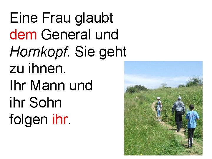 Eine Frau glaubt dem General und Hornkopf. Sie geht zu ihnen. Ihr Mann und