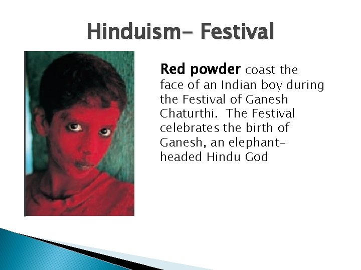 Hinduism- Festival Red powder coast the face of an Indian boy during the Festival