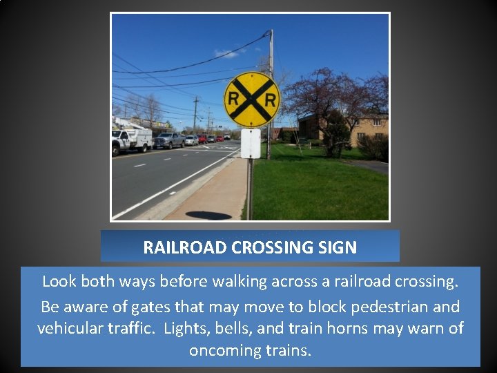 RAILROAD CROSSING SIGN Look both ways before walking across a railroad crossing. Be aware