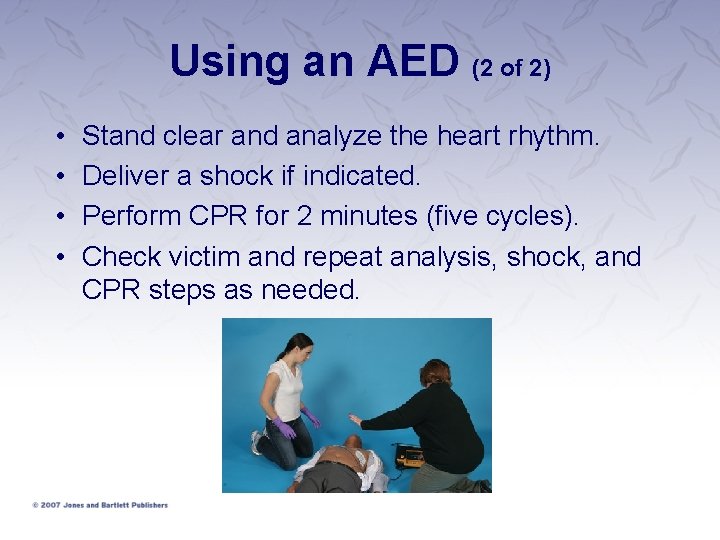 Using an AED (2 of 2) • • Stand clear and analyze the heart