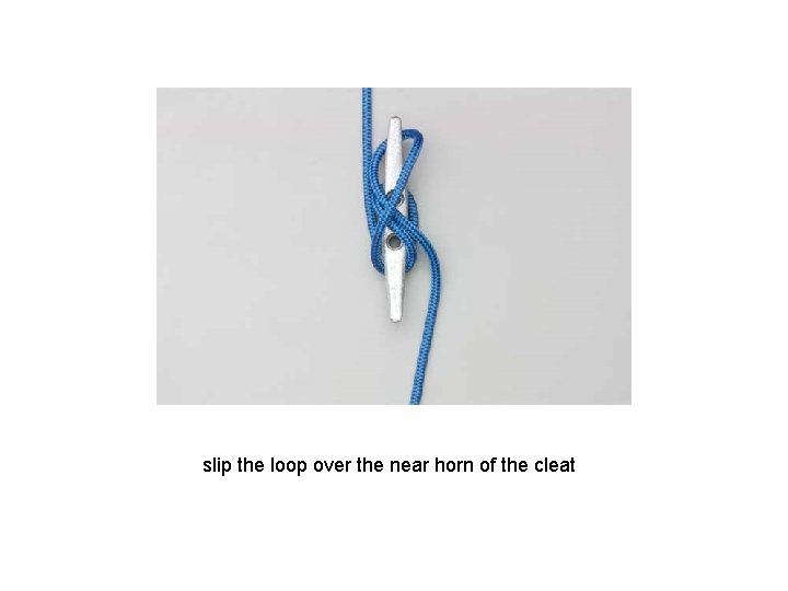 slip the loop over the near horn of the cleat 