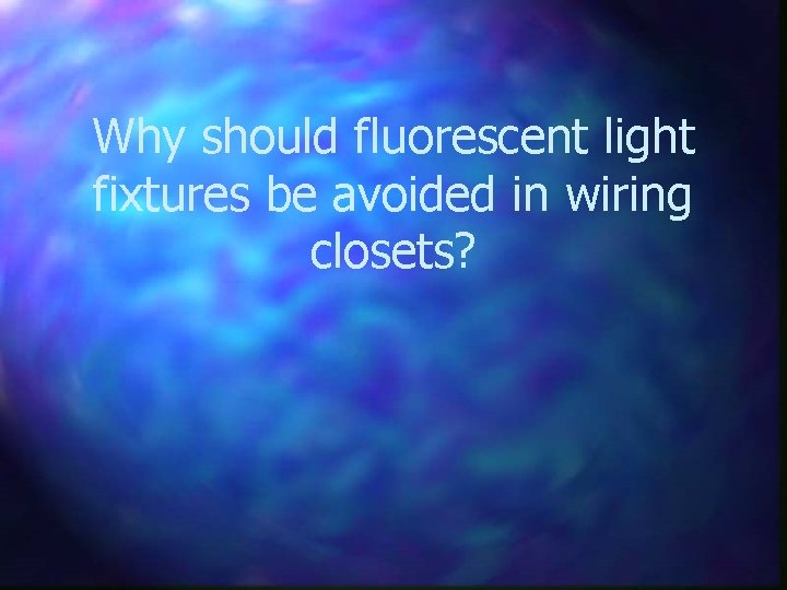 Why should fluorescent light fixtures be avoided in wiring closets? 