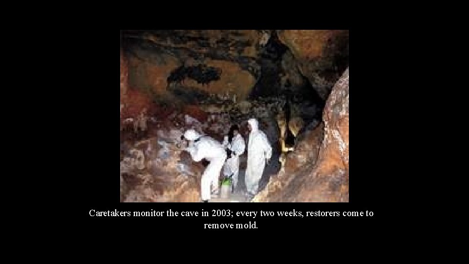 Caretakers monitor the cave in 2003; every two weeks, restorers come to remove mold.