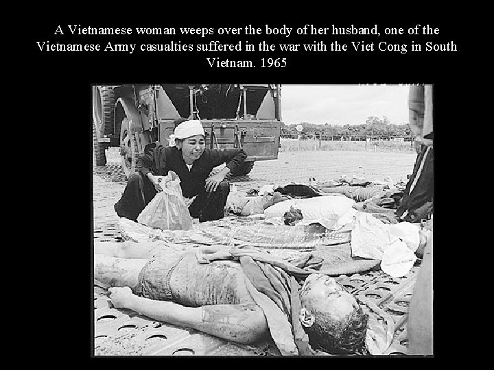 A Vietnamese woman weeps over the body of her husband, one of the Vietnamese