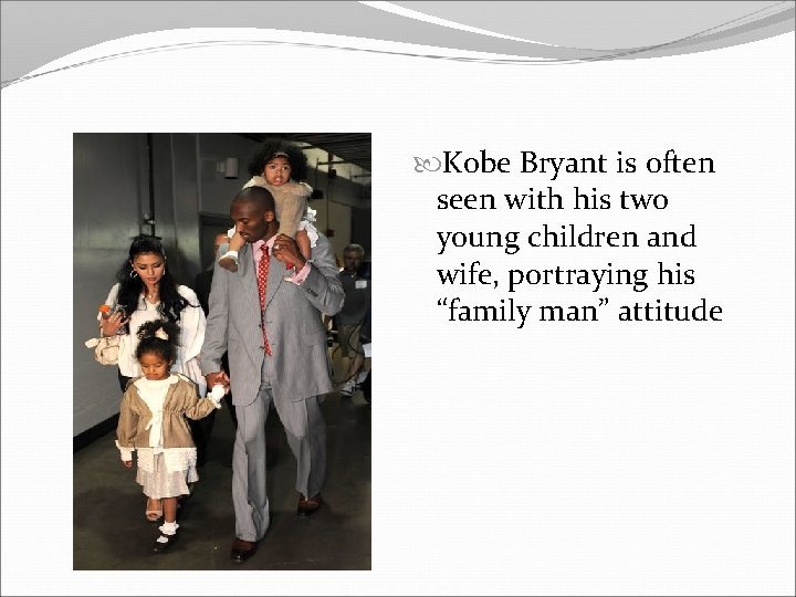  Kobe Bryant is often seen with his two young children and wife, portraying