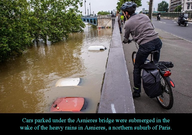 Cars parked under the Asnieres bridge were submerged in the wake of the heavy